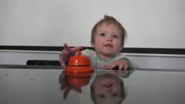 WESTMINSTER COLORADO-2015: Cute Little Toddler Seated By The Dining Table And Playing