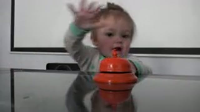 WESTMINSTER COLORADO-2015: Cute Toddler Seated At The Dining Table Reaching For