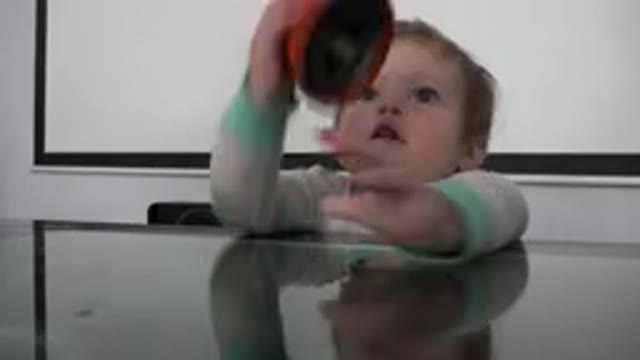 WESTMINSTER COLORADO-2015: Cute Little Toddler Sitting By The Dining Table And Reaching Upwards