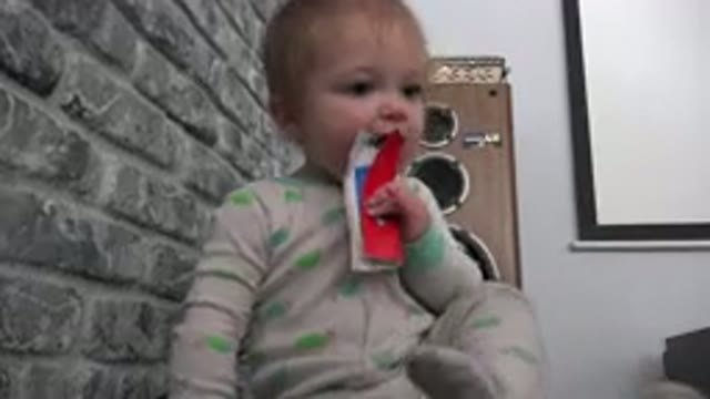 WESTMINSTER COLORADO-2015: Baby Teething On A Piece Of Paper While Wearing A