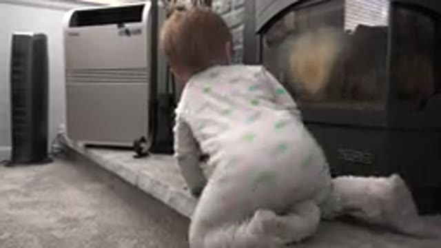 WESTMINSTER COLORADO-2015: Infant Wearing Green and White Sleeper Crawls on Carpet