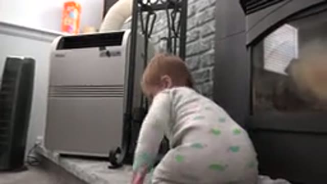 WESTMINSTER COLORADO-2015: Baby Playing On A Fireplace Trying To Balance While