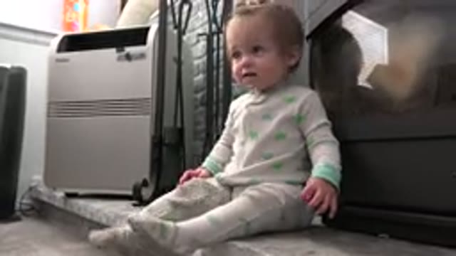 WESTMINSTER COLORADO-2015: Little Girl Sitting On The Floor And Looking Around