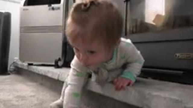 WESTMINSTER COLORADO-2015: Baby Sitting In Front Of A Stove Or Heater On A Low Shelf