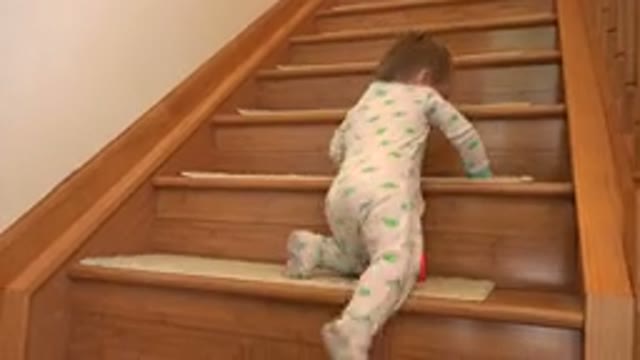 WESTMINSTER COLORADO-2015: Infant Girl in Pajamas Crawling Up Wooden Staircase