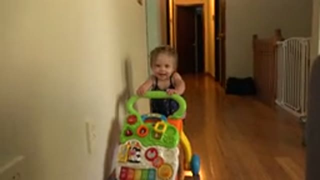 WESTMINSTER COLORADO-2015: Cute Baby Pushes Cart and Smiles While Laughing