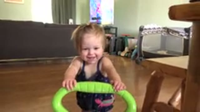 WESTMINSTER COLORADO-2015: Toddler Using Walker to Move Across Floor Indoors