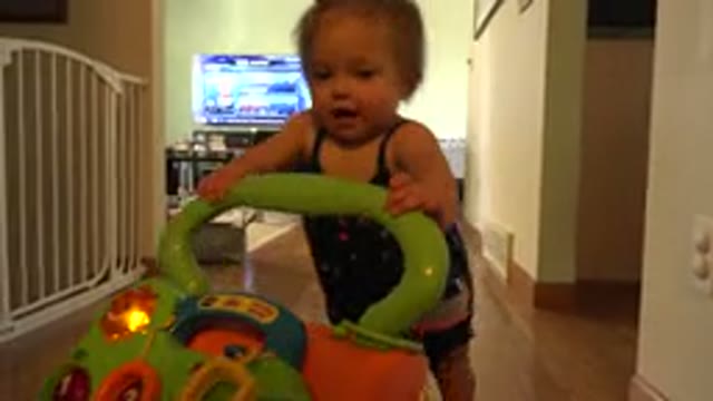 WESTMINSTER COLORADO-2015: Tiny Baby Child With Toy Walks Up To Camera And Points
