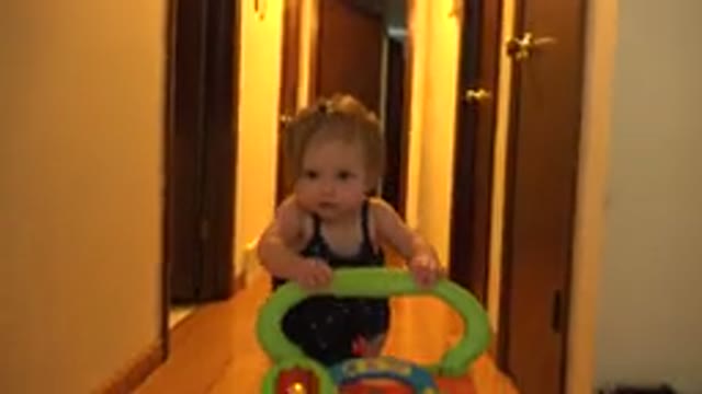 WESTMINSTER COLORADO-2015: Baby Learning To Walk Supported By Toy Walker