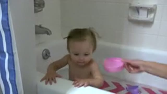 WESTMINSTER COLORADO-2015: Baby Playing In The Bathtub While Adult Woman Puts