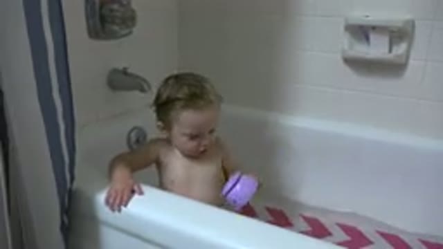 WESTMINSTER COLORADO-2015: Small Child In The Bath Taking A Bath And Holding A Toy