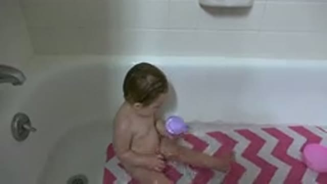 WESTMINSTER COLORADO-2015: Baby In A Bathtub Playing With A Purple Mug