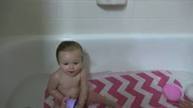 WESTMINSTER COLORADO-2015: Baby Taking A Bath While Holding A Cup And Tries To