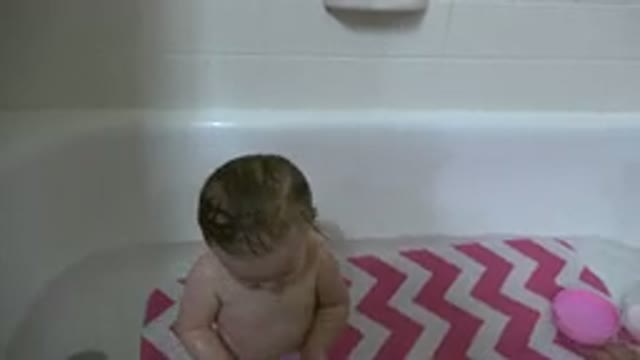 WESTMINSTER COLORADO-2015: Handsome Cute Toddler In A Bathtub Holding A Purple Cup