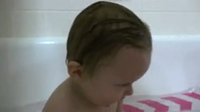 WESTMINSTER COLORADO-2015: Mother Giving A Very Affectionate Bath To Her Son Who