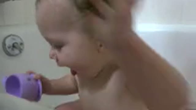 WESTMINSTER COLORADO-2015: Baby Playing In Bathtub Filled With Water With Toy