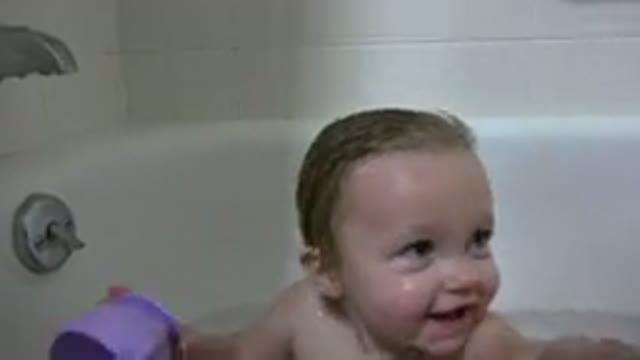 WESTMINSTER COLORADO-2015: Playful Infant Drinks Bathwater During Afternoon Wash