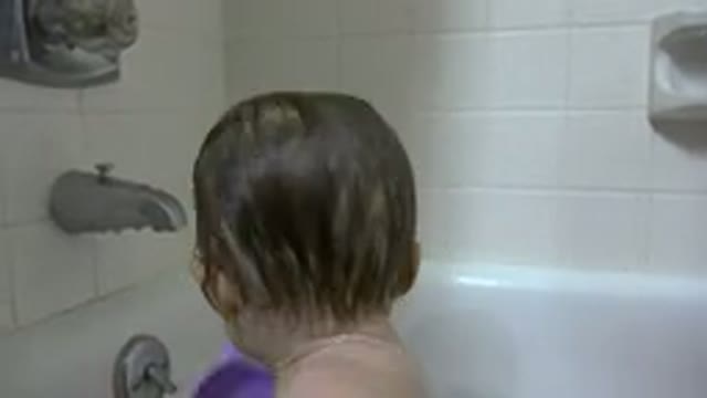 WESTMINSTER COLORADO-2015: A Small Baby Playing In The Tub In The Bathroom