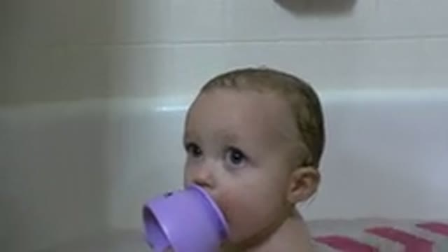 WESTMINSTER COLORADO-2015: Baby Boy Taking A Bath While Biting His Purple Cup