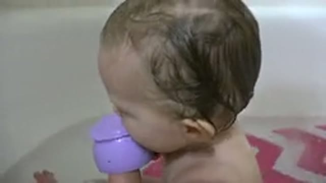 WESTMINSTER COLORADO-2015: Baby Sitting In A Bathtub And Playing With Water