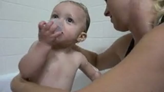 WESTMINSTER COLORADO-2015: Children Have Fun Playing With Their Mother During A Bath