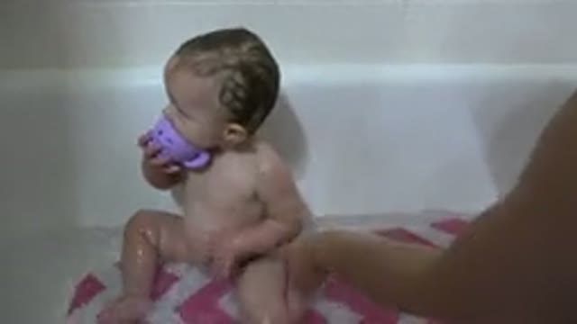 WESTMINSTER COLORADO-2015: Happy Toddler During Routine Bubble Bath With Parent