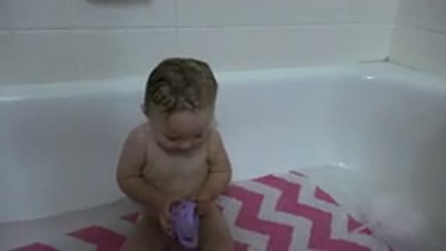 WESTMINSTER COLORADO-2015: Child Has Fun Playing With His Mother While In Her Bathtub