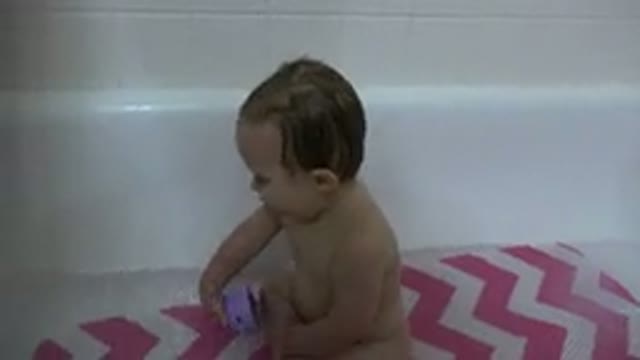 WESTMINSTER COLORADO-2015: Baby Playing In Bathtub With Purple Bath Toy