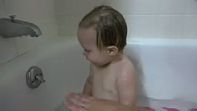 WESTMINSTER COLORADO-2015: A Baby Tries To Keep The Water In The Bath After Mom