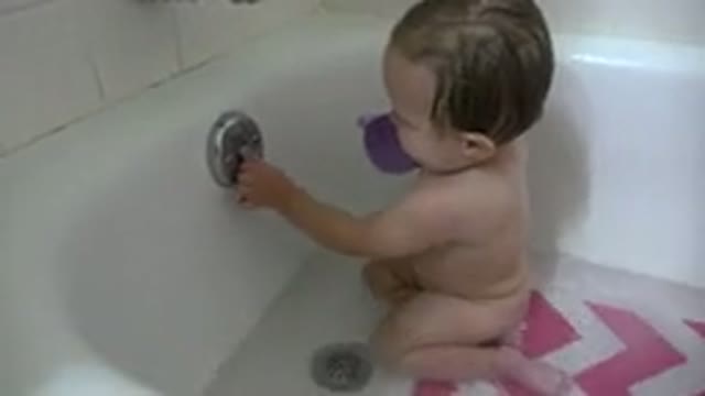 WESTMINSTER COLORADO-2015: Small Baby Plays In The Bathtub With Purple Teacup