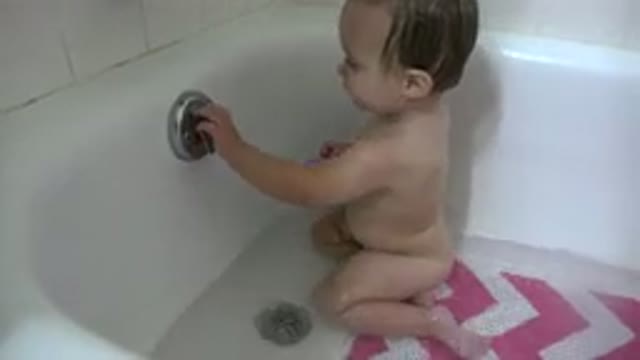 WESTMINSTER COLORADO-2015: Child Has Fun Playing In The Bathtub With His Toy