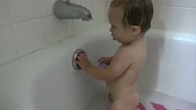 WESTMINSTER COLORADO-2015: Young Baby Playing in Bathtub