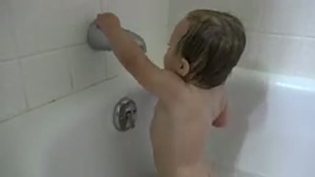 WESTMINSTER COLORADO-2015: Baby Plays In A Bathtub With A Red And White Chevron Pattern