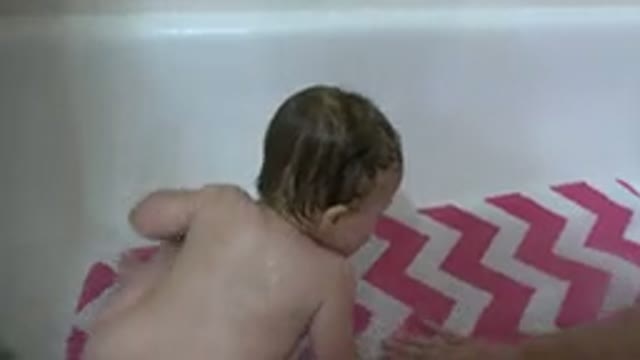 WESTMINSTER COLORADO-2015: Toddler Crawls in Tub on Pink and White Bathtub Mat