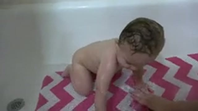 WESTMINSTER COLORADO-2015: Baby Playing With Water At Bath Time With His Mother