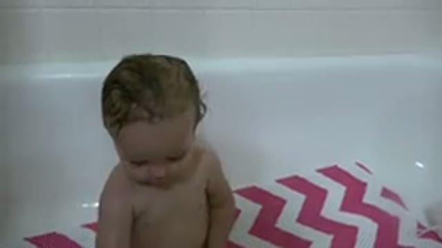WESTMINSTER COLORADO-2015: Baby Playing In Bathtub With Purple Bath Toy And