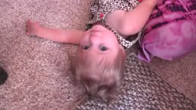 WESTMINSTER COLORADO-2015: A Cute Little Girl Lying On The Floor And Looking Up