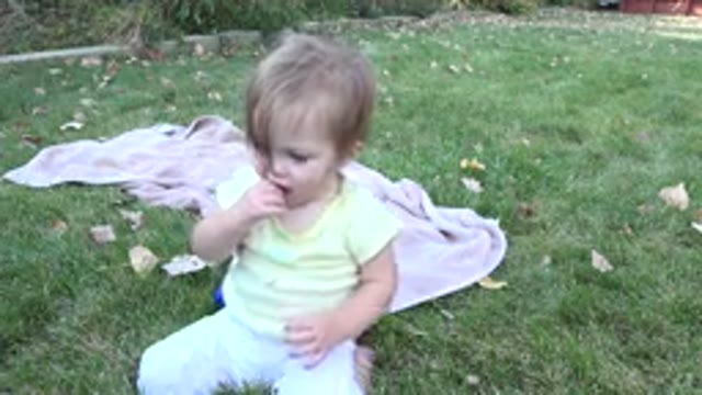 WESTMINSTER COLORADO-2015: Cute Little Girl Sitting On The Grass With A Dog