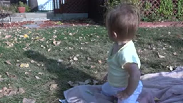 WESTMINSTER COLORADO-2015: Child Catching The Sun In Home Garden On Hot Day
