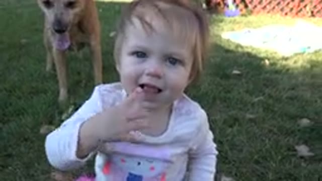WESTMINSTER COLORADO-2015: The Happy And Contented Little Girl Playing With Her Dog