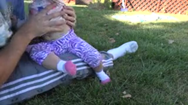 WESTMINSTER COLORADO-2015: Person Wearing Grey Pants Holds Toddler Wearing White