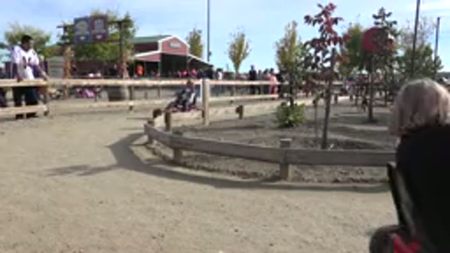 BRIGHTON COLORADO-2015: Dirt Track With Children Riding A Pedal-Powered Go-Kart