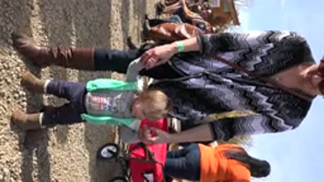 BRIGHTON COLORADO-2015: A Mother Giving Her Little Toddler Support As He Stands