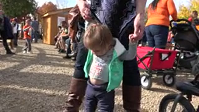 BRIGHTON COLORADO-2015: Mom Helps Her Baby Girl Stand