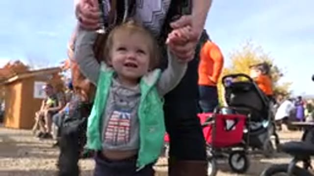 BRIGHTON COLORADO-2015: Child Steps Walking Fair Farmers Sand Carriage Girl