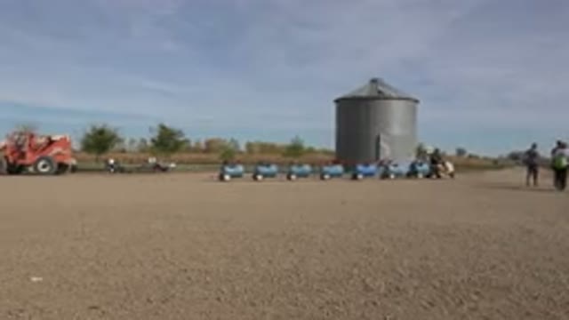BRIGHTON COLORADO-2015: Field With People And A Little Electric Train In The