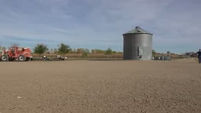 BRIGHTON COLORADO-2015: Farm With People Trucking Things Around With A Tractor