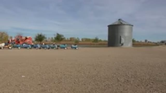 BRIGHTON COLORADO-2015: People Walking Around On A Farm Land Type Place