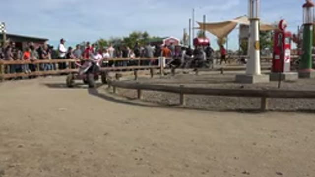 BRIGHTON COLORADO-2015: Adults Racing Pedal-Powered Tractor Carts on Dirt Track