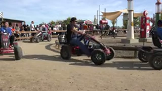 BRIGHTON COLORADO-2015: Riding Four Wheeled Bicycles Going In Circles Amusement